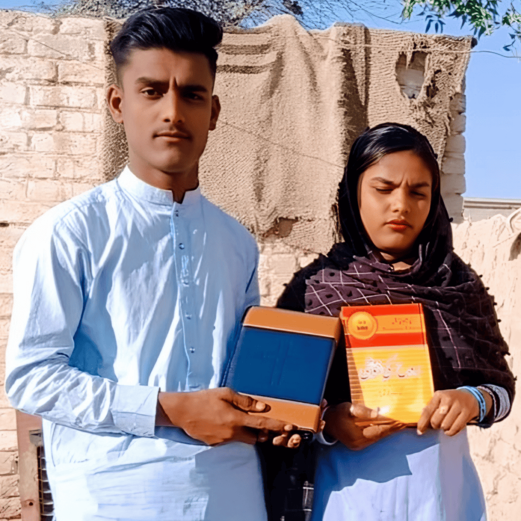 A young man in a white tunic and a young woman in a black headscarf solemnly hold Bibles, with a simple woven backdrop behind them, reflecting a sense of earnest devotion.